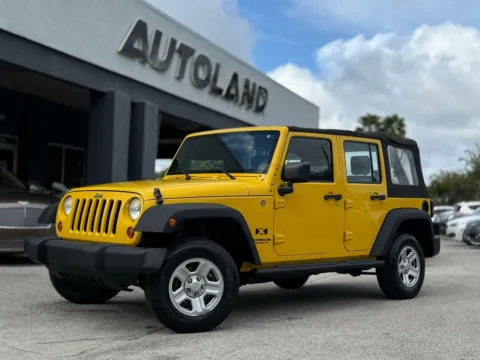 Yellow 2009 Jeep Wrangler Unlimited X for sale in Jacksonville, FL
