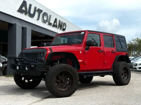 Red 2014 Jeep Wrangler Unlimited Sahara for sale in Jacksonville, FL