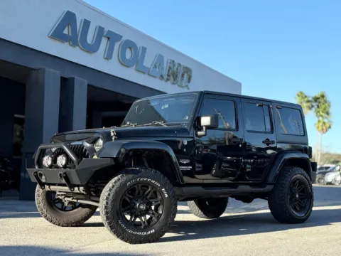 Black 2012 Jeep Wrangler Unlimited Sahara for sale in Jacksonville, FL