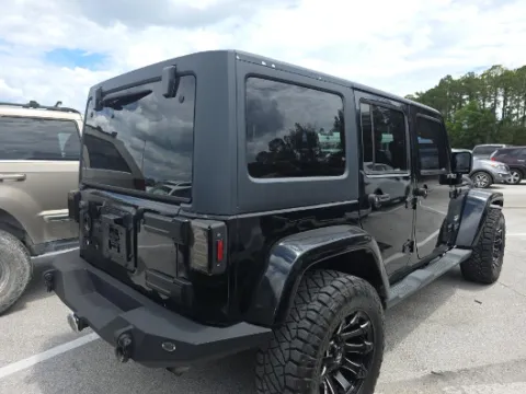 Photos of 2014 Jeep Wrangler Unlimited Sahara for sale in Plano, TX at Gulliver Auto Group