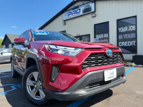 Red 2023 TOYOTA RAV4 HYBRID LE for sale in Crown Point, IN