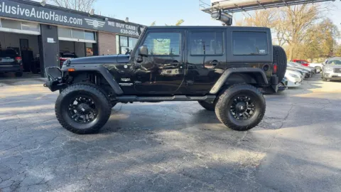 Another view of 2015 Jeep Wrangler Unlimited Sahara Sport Utility 4D for sale in Roselle, IL at Exclusive Autohaus - Roselle