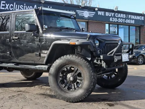 Another view of 2015 Jeep Wrangler Unlimited Sahara Sport Utility 4D for sale in Roselle, IL at Exclusive Autohaus - Roselle