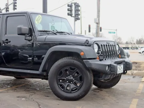 Another view of 2013 Jeep Wrangler Unlimited Sahara Moab Sport Utility 4D for sale in Roselle, IL at Exclusive Autohaus - Roselle