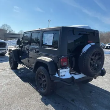 Another view of 2013 Jeep Wrangler Unlimited Sahara Moab Sport Utility 4D for sale in Roselle, IL at Exclusive Autohaus - Roselle