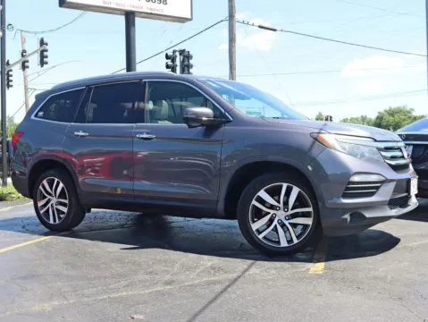 Photos of 2017 Honda Pilot Touring Sport Utility 4D for sale in Roselle, IL at Exclusive Autohaus - Roselle