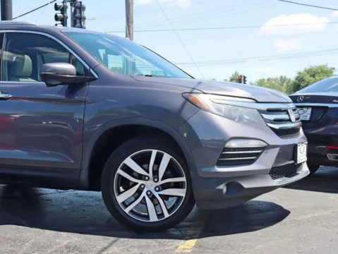 Another view of 2017 Honda Pilot Touring Sport Utility 4D for sale in Roselle, IL at Exclusive Autohaus - Roselle
