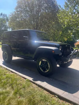 Another view of 2016 Jeep Wrangler Unlimited Black Bear Sport Utility 4D for sale in Roselle, IL at Exclusive Autohaus - Roselle