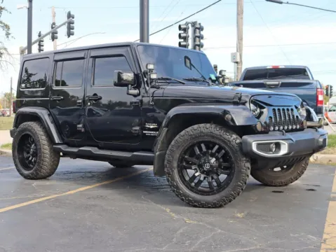 Photos of 2015 Jeep Wrangler Unlimited Sahara Sport Utility 4D for sale in Roselle, IL at Exclusive Autohaus - Roselle