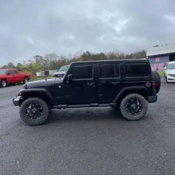 Another view of 2014 Jeep Wrangler Unlimited Altitude Sport Utility 4D for sale in Roselle, IL at Exclusive Autohaus - Roselle