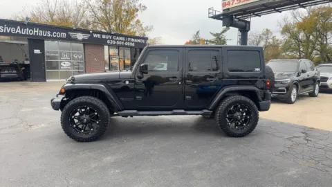 Another view of 2014 Jeep Wrangler Unlimited Altitude Sport Utility 4D for sale in Roselle, IL at Exclusive Autohaus - Roselle