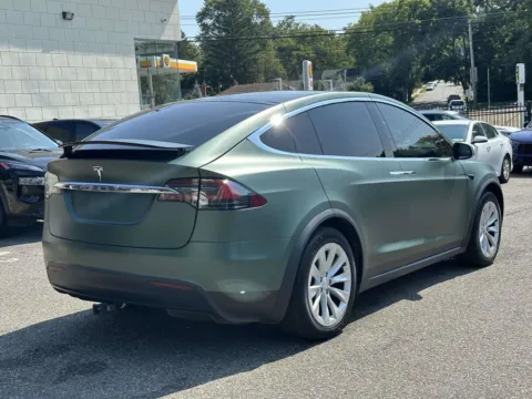 Another view of 2019 Tesla Model X Long Range (Matte Green Wrap) for sale in Great Neck, NY at Certified Luxury Motors - Great Neck