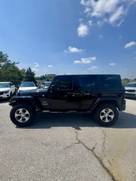 Photos of 2016 Jeep Wrangler Unlimited Sahara for sale in Lee's Summit, MO at Cable Dahmer Kia of Lee's Summit