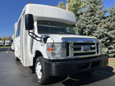 Another view of 2013 Ford E-450 15 Passenger Shuttle Bus with Wheelchair Lift for sale in Crystal Lake, IL at Signature Truck Center