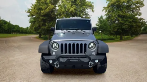 Another view of 2013 Jeep Wrangler Unlimited Sport SUV 4D for sale in Candler, NC at Sunny and 70 Auto Sales