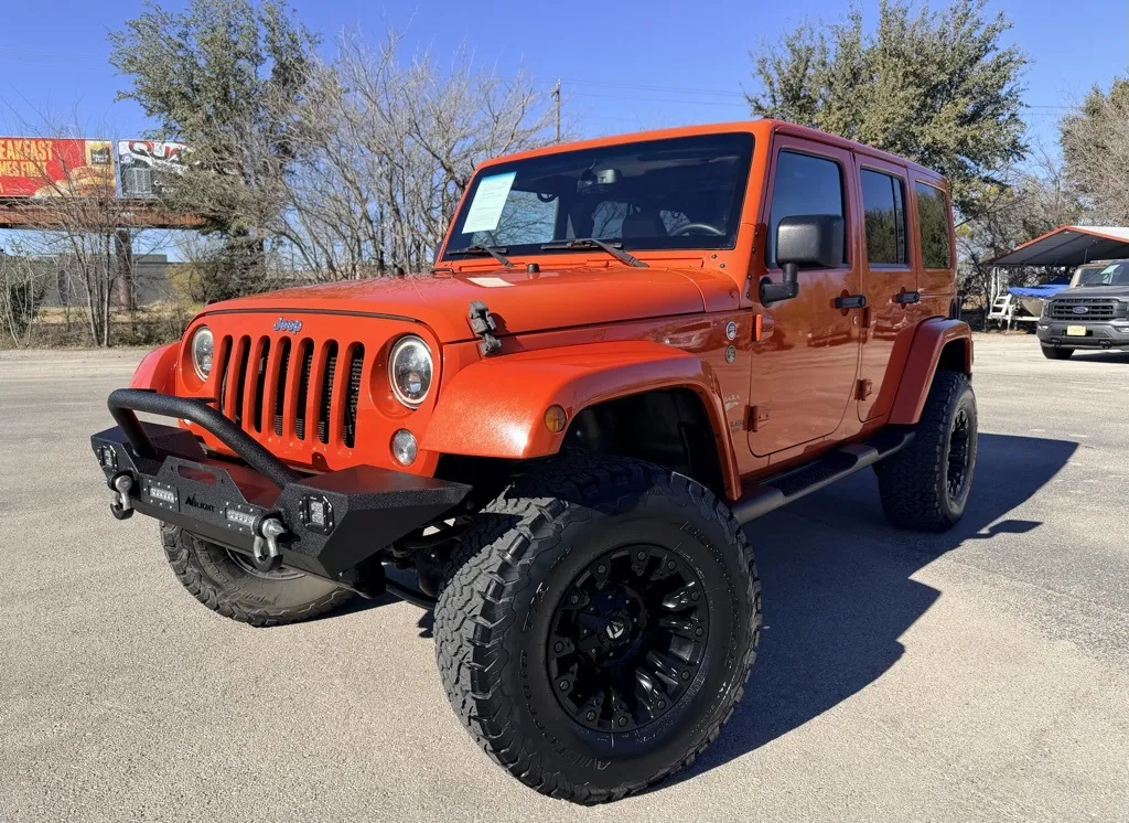 Orange 2015 Jeep Wrangler Unlimited Sahara for sale in Abilene, TX
