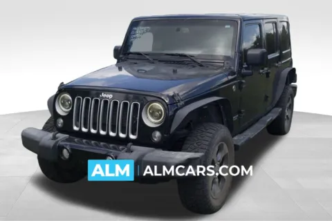 Black 2016 Jeep Wrangler Unlimited Sahara for sale in Lumberton, NC