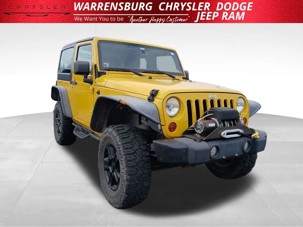 Yellow 2011 Jeep Wrangler Sport for sale in Warrensburg, MO