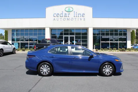 Blue 2023 Toyota Camry Hybrid LE for sale in Spout Spring, VA