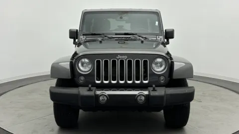 Photos of 2016 Jeep Wrangler Unlimited Sahara for sale in Jacksonville, FL at Auto Boutique Florida