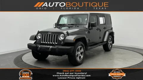 Gray 2016 Jeep Wrangler Unlimited Sahara for sale in Jacksonville, FL