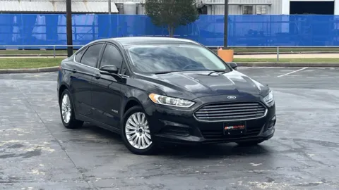 Black 2015 FORD FUSION SE HYBRI SE Hybrid for sale in Alvin, TX