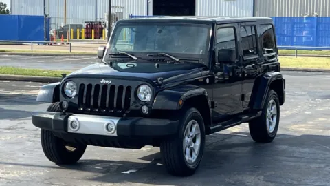 Black 2014 Jeep Wrangler Unlimited Sahara for sale in Alvin, TX