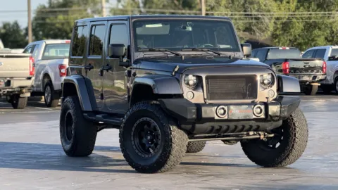 Gray 2016 JEEP WRANGLER U Sahara for sale in Alvin, TX