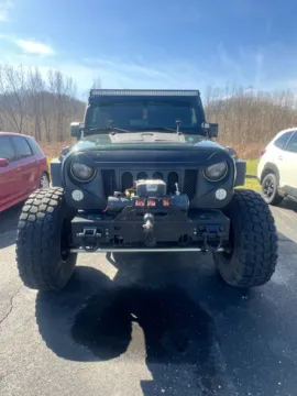 Photos of 2011 Jeep Wrangler Unlimited Sport for sale in Athens, OH at Don Wood Ford Lincoln