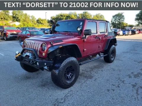Red 2011 Jeep Wrangler Unlimited Sport for sale in Terre Haute, IN