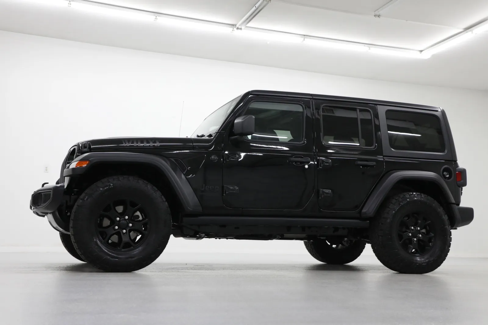 Used 2021 Jeep Wrangler Unlimited Willys with VIN 1C4HJXDG2MW612719 for sale in Kansas City