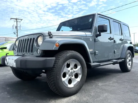 Gray 2014 Jeep Wrangler Unlimited Sahara for sale in Clinton, MO
