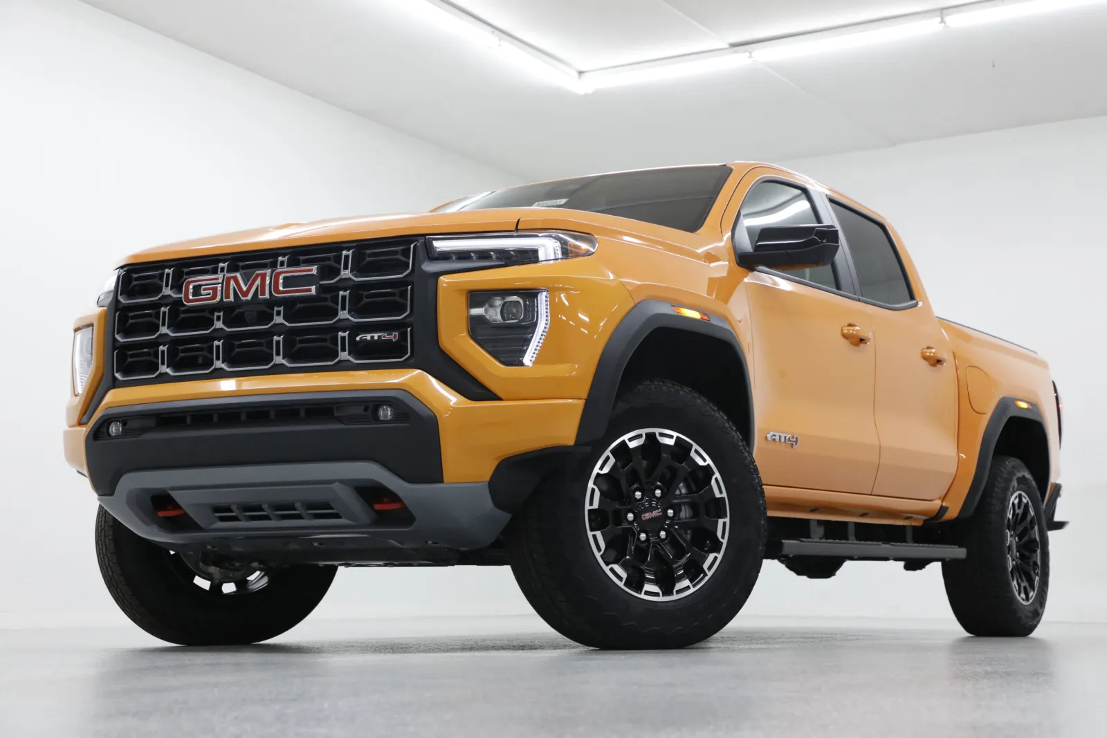 Orange 2026 GMC Canyon 4WD AT4 for sale in Clinton, MO