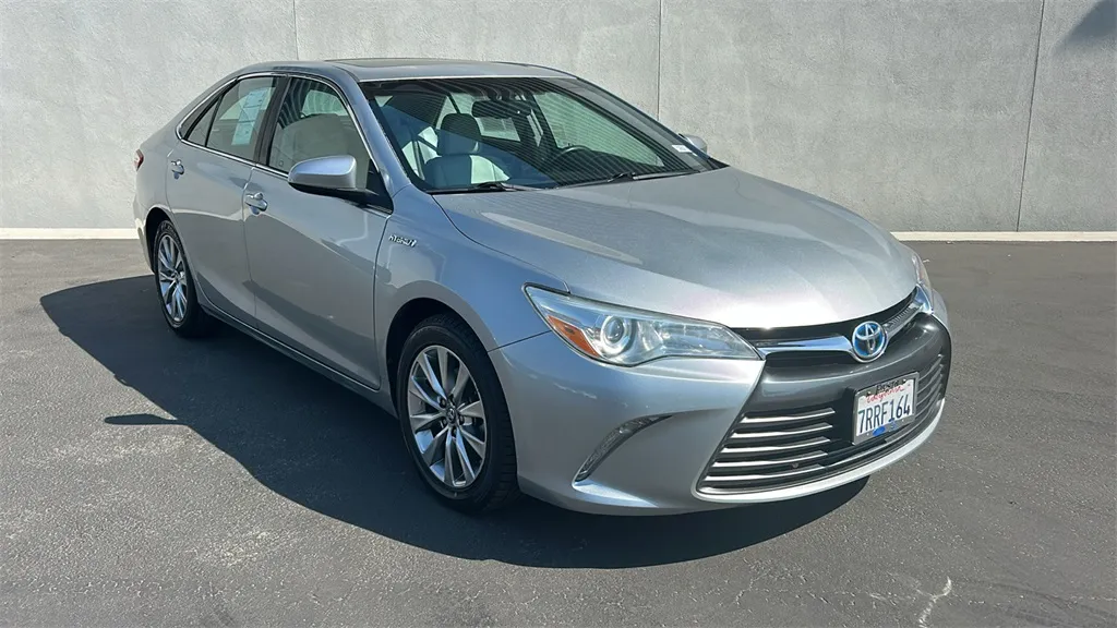 Silver 2016 Toyota Camry Hybrid XLE for sale in Indio, CA