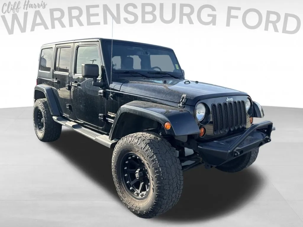 Black 2013 Jeep Wrangler Unlimited Sahara for sale in Warrensburg, MO