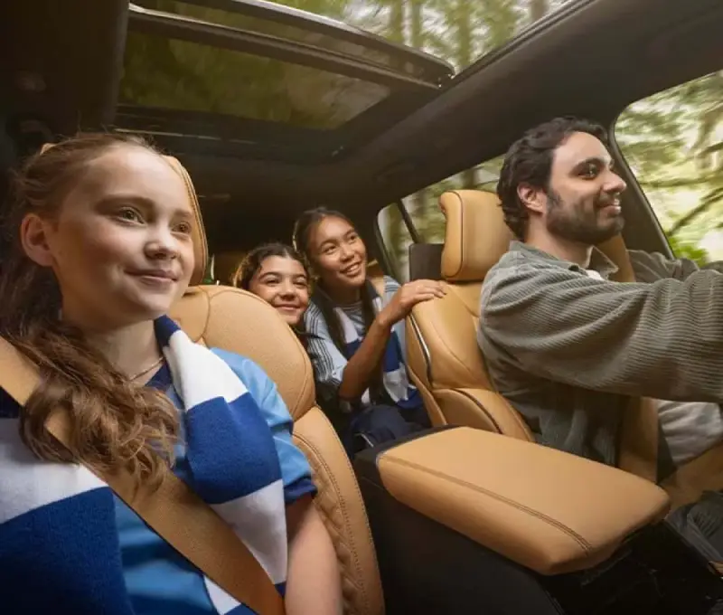 2025 Jeep Grand Cherokee driving on a winding road