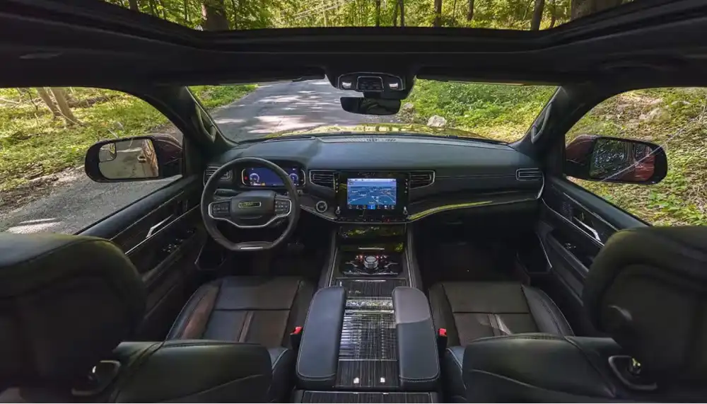 Wagoneer interior with dashboard, steering wheel, center console, and touchscreen display