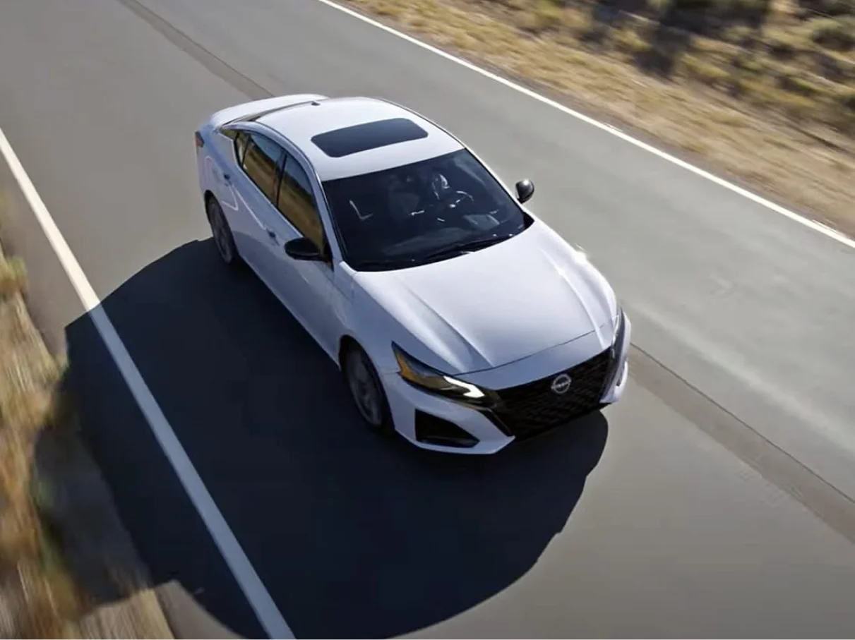 2025 Nissan Altima driving on open road top view