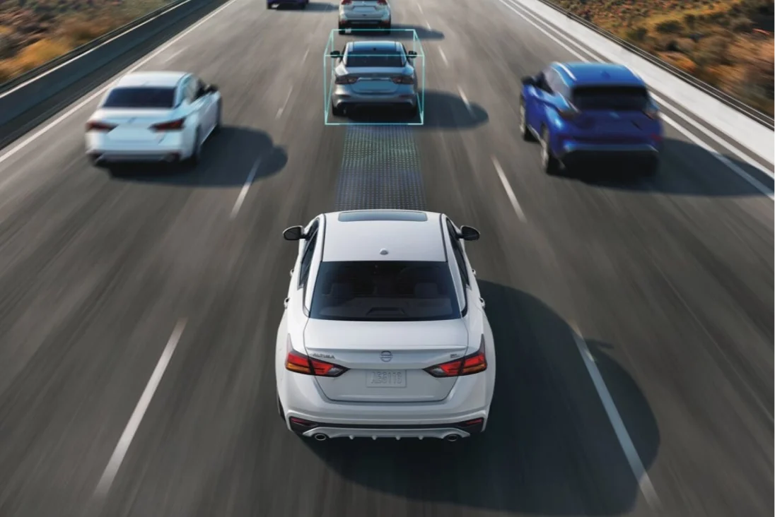 Nissan Altima with driver assistance system detecting vehicles on highway
