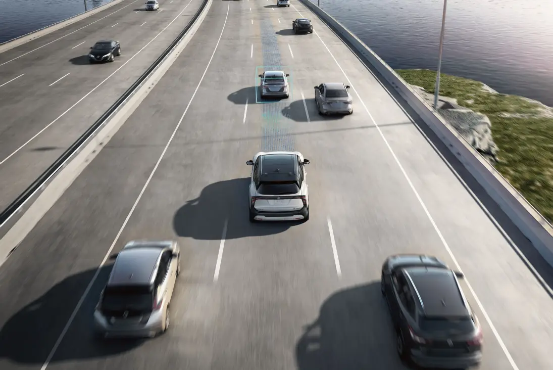 Nissan Kicks driving on highway with driver assistance features