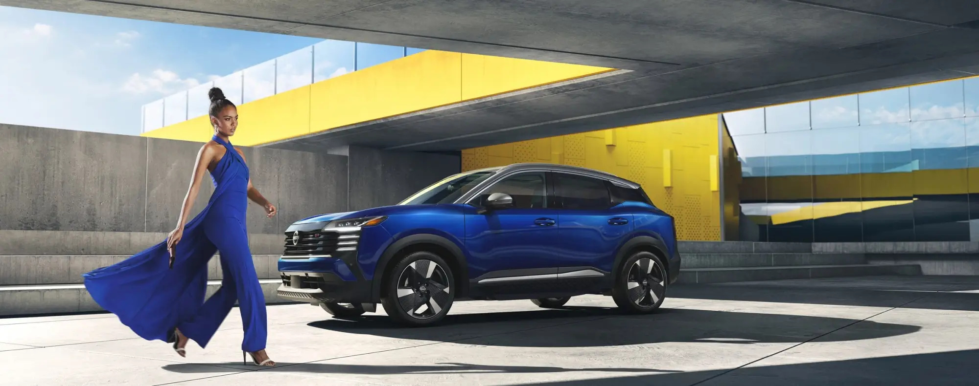 Blue Nissan Kicks parked in modern urban setting