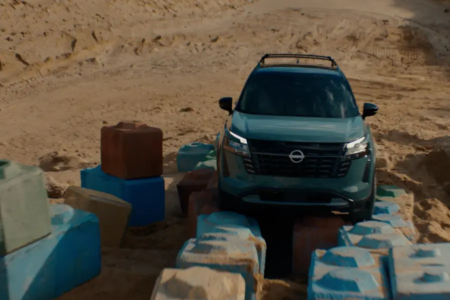 2025 Nissan Pathfinder with intelligent 4WD driving on a dirt road
