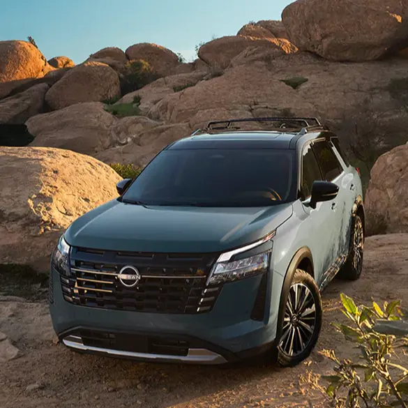 2025 Nissan Pathfinder exterior parked among rocky off-road landscape